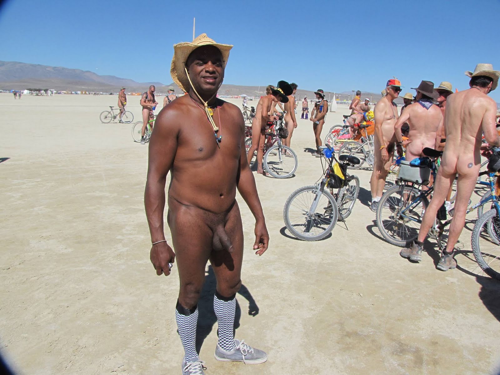 Nude on a bike at Burning Man. - nudeshots